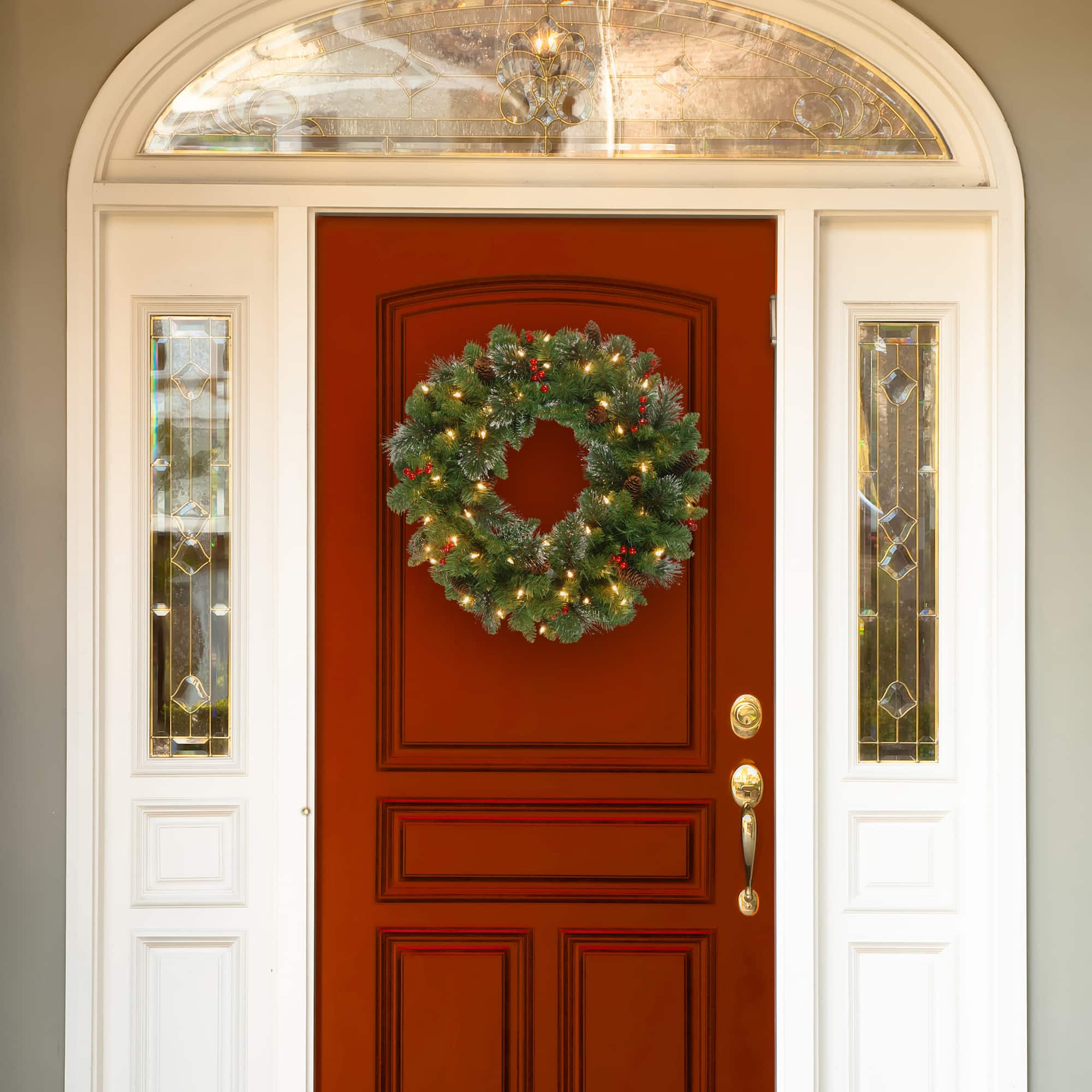 30" Crestwood® Spruce Wreath with Pine Cones, Red Berries, Glitter & Clear Lights